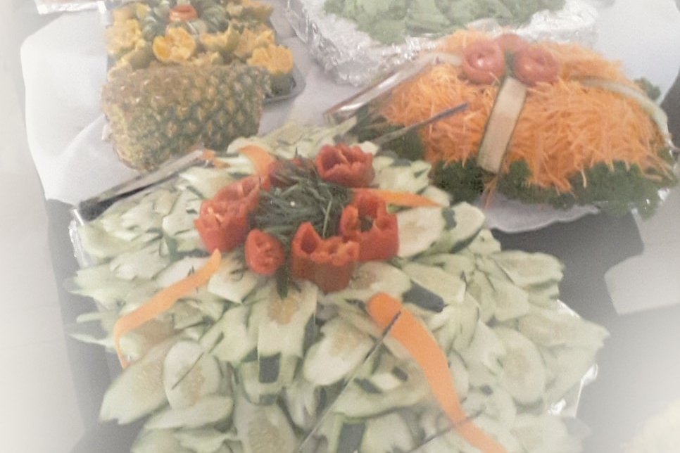 A spread of fresh fruit and vegetables laid out for a house full of guests